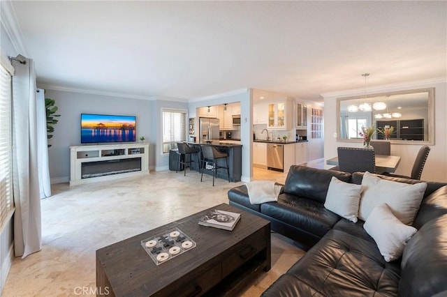 711 Pacific Coast Unit 313, Huntington Beach, CA 92648 - living area with an inviting chandelier, ornamental molding, and baseboards
