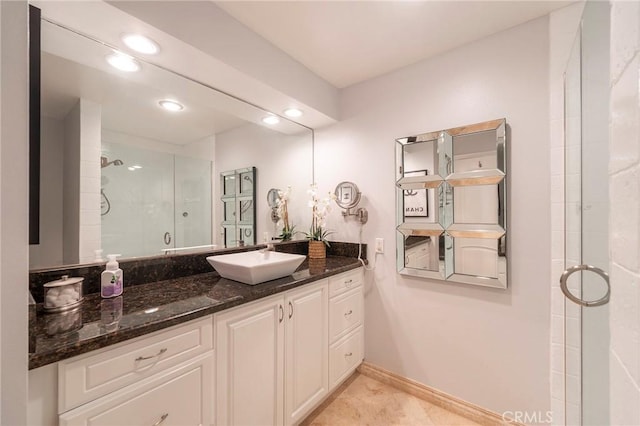 711 Pacific Coast Unit 313, Huntington Beach, CA 92648 - full bath featuring a shower stall, baseboards, vanity, and recessed lighting