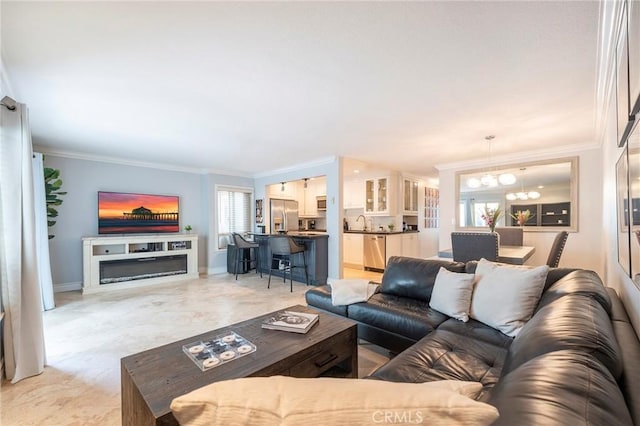 711 Pacific Coast Unit 313, Huntington Beach, CA 92648 - living area with an inviting chandelier, crown molding, and baseboards