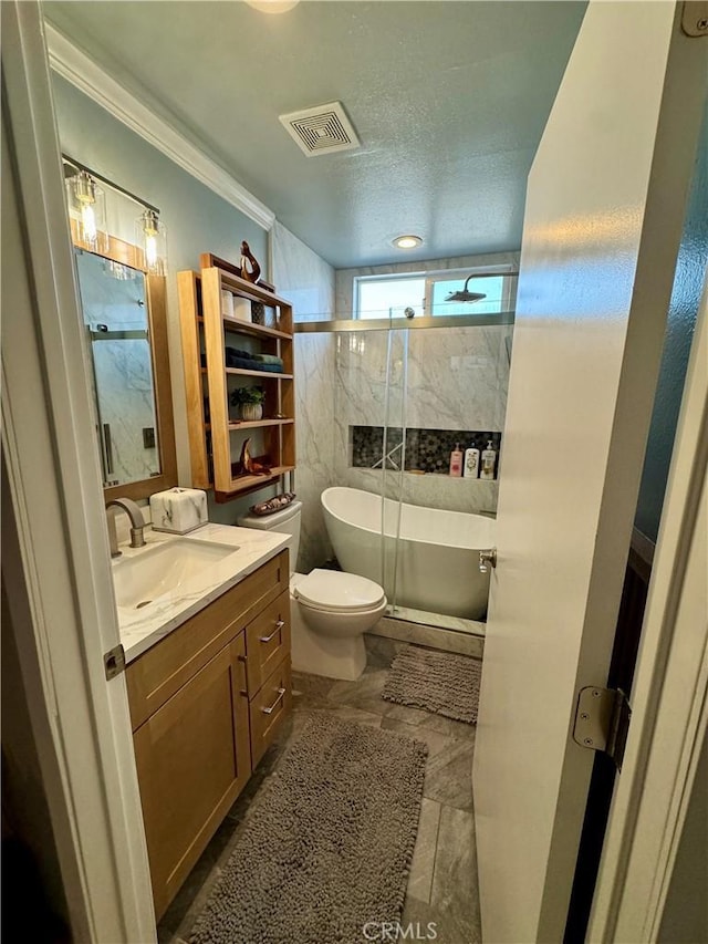 full bathroom featuring toilet, crown molding, bath / shower combo with glass door, a textured ceiling, and vanity