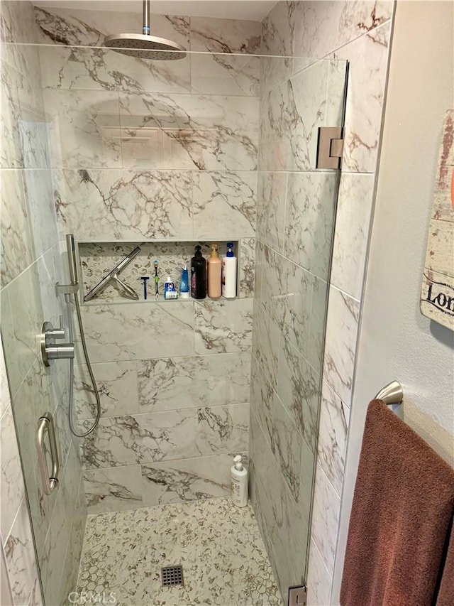 bathroom featuring a shower stall