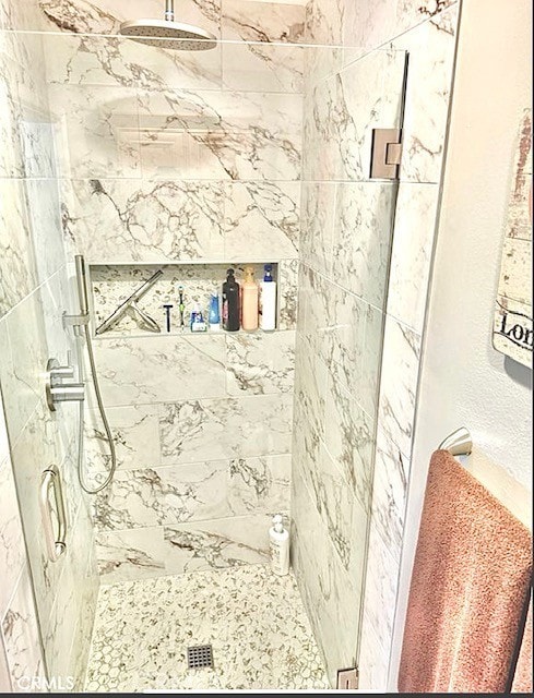 full bath with a shower stall