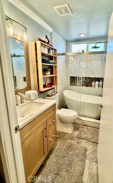 full bathroom with crown molding, vanity, toilet, visible vents, and a stall shower
