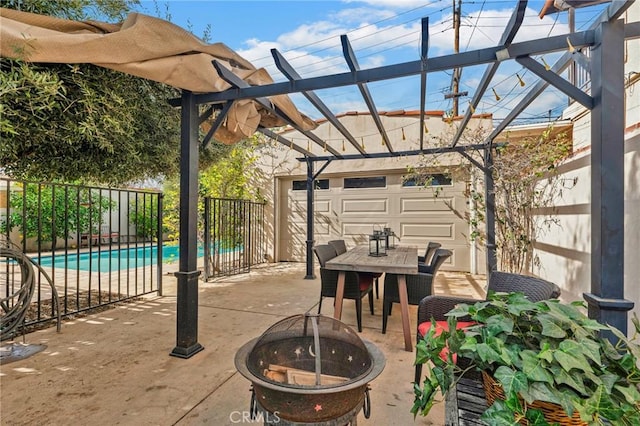 view of patio / terrace featuring an outdoor fire pit, a fenced in pool, fence private yard, outdoor dining area, and a pergola