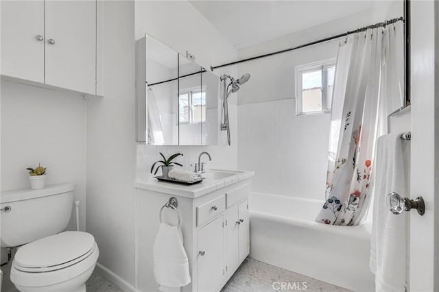 bathroom featuring vanity, toilet, and shower / bath combo with shower curtain