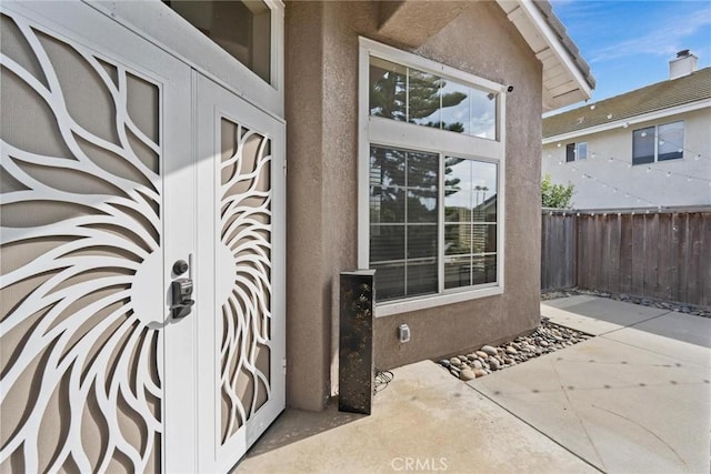 property entrance with a patio