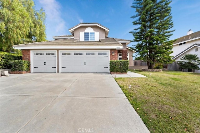 view of property with a garage and a front yard