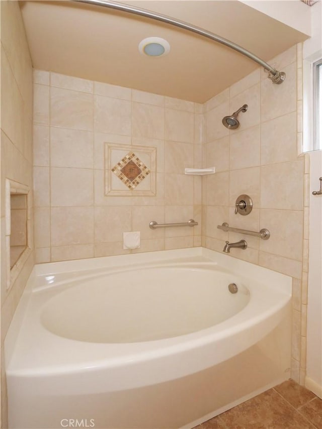 bathroom featuring a bath and tile patterned floors