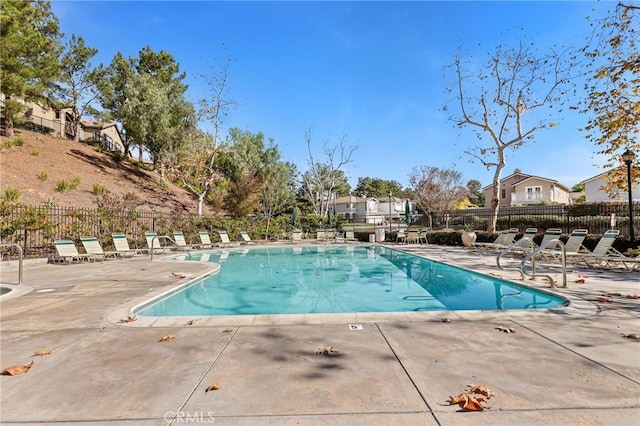 view of swimming pool featuring a patio area