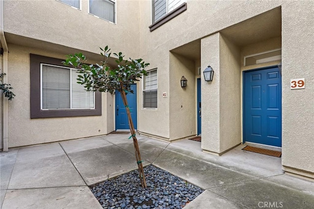 property entrance with a patio