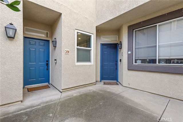 doorway to property with a patio