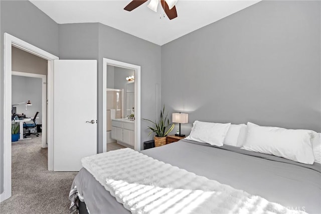 carpeted bedroom with ceiling fan and ensuite bathroom