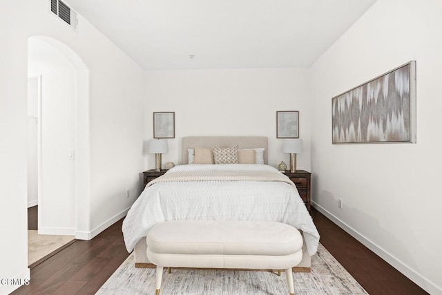 bedroom with wood-type flooring