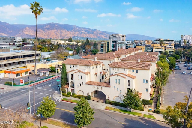 birds eye view of property featuring a mountain view