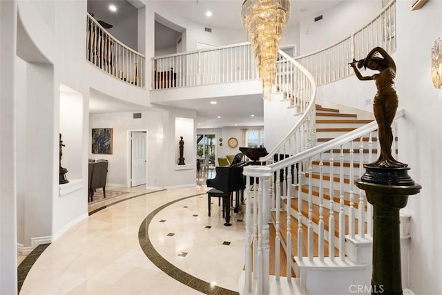 28622 Point Loma, Laguna Niguel, CA 92677 - entryway featuring inlaid floor details, baseboards, a high ceiling, stairs, and recessed lighting