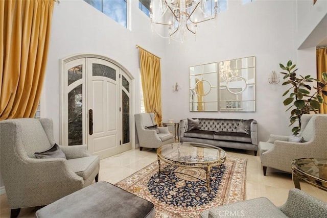 28622 Point Loma, Laguna Niguel, CA 92677 - sitting room featuring a chandelier, healthy amount of natural light, a towering ceiling, and marble finish flooring