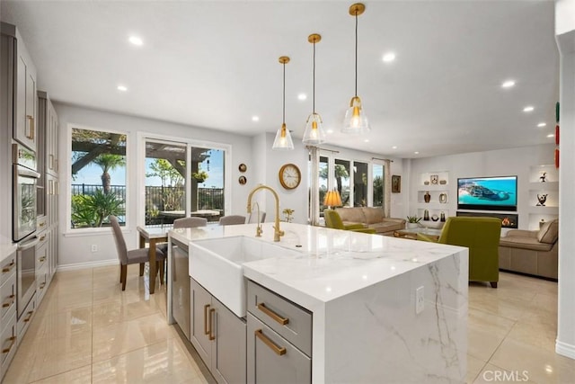 28622 Point Loma, Laguna Niguel, CA 92677 - kitchen with a sink, appliances with stainless steel finishes, gray cabinets, recessed lighting, and light stone counters