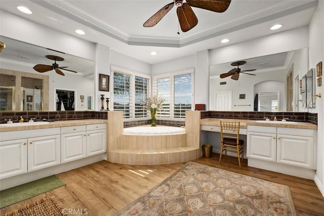 28622 Point Loma, Laguna Niguel, CA 92677 - full bath featuring a ceiling fan, ornamental molding, vanity, a garden tub, and wood finished floors