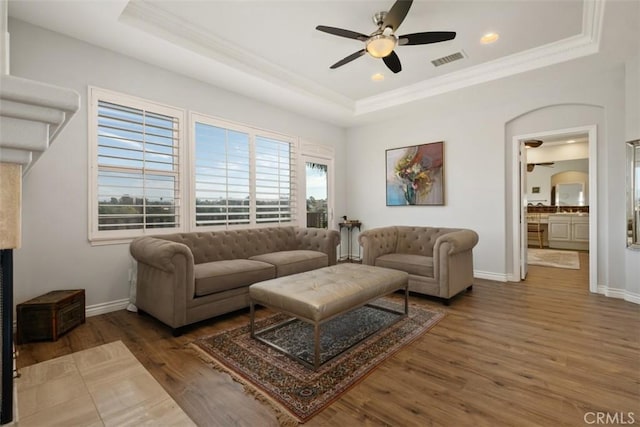 28622 Point Loma, Laguna Niguel, CA 92677 - living room featuring ornamental molding, a raised ceiling, ceiling fan, wood finished floors, and baseboards