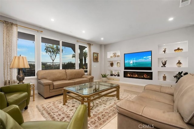 28622 Point Loma, Laguna Niguel, CA 92677 - living room with built in shelves, a glass covered fireplace, and recessed lighting