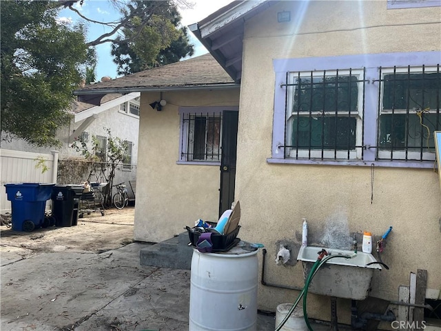 view of side of property featuring a patio