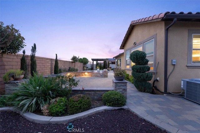 view of yard featuring a patio, cooling unit, and a fenced backyard