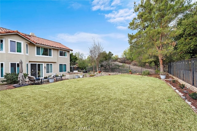 view of yard with a fenced backyard