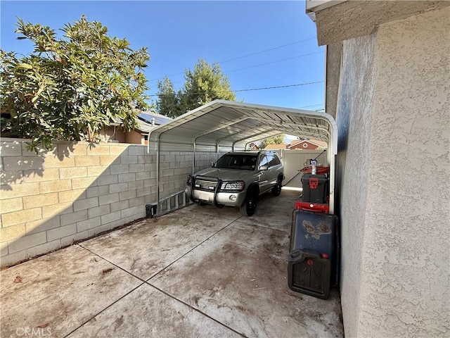 view of vehicle parking with a carport