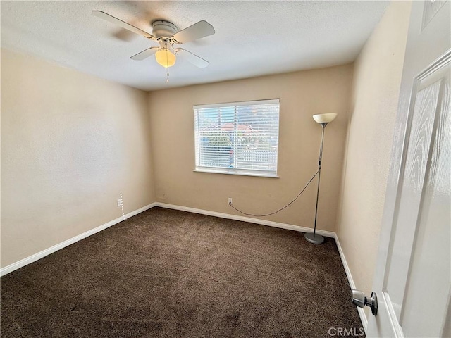 carpeted spare room featuring a textured ceiling and ceiling fan