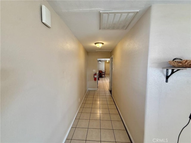 hallway featuring light tile patterned floors