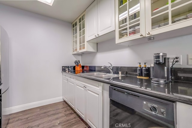 kitchen featuring white cabinetry, black dishwasher, sink, and dark hardwood / wood-style flooring