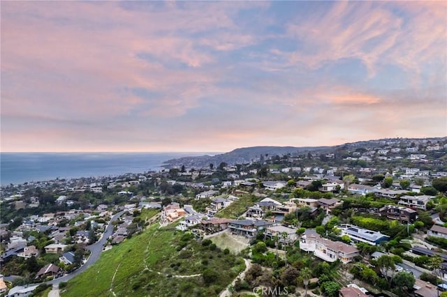 aerial view at dusk with a water view