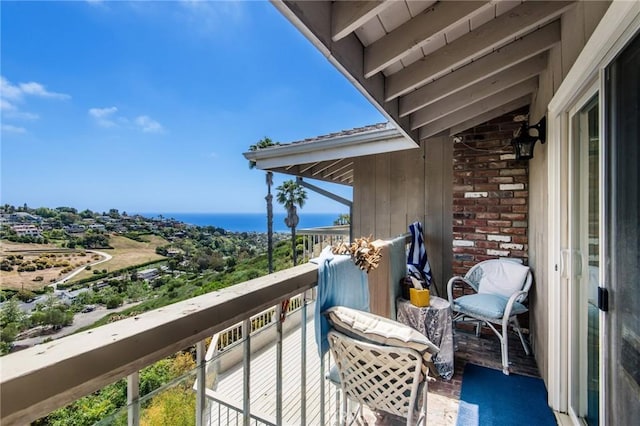 balcony featuring a water view