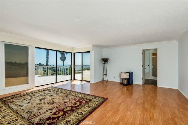 living room featuring hardwood / wood-style flooring and ornamental molding