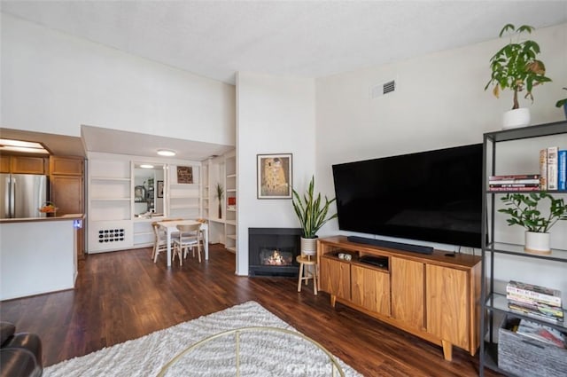 living room with dark wood-type flooring