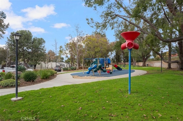 view of playground featuring a lawn