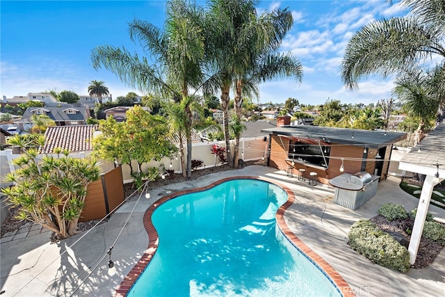 view of swimming pool with a patio area