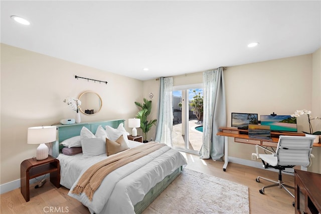 bedroom featuring access to outside and light hardwood / wood-style floors