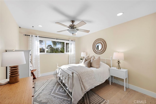 bedroom with ceiling fan and light wood-type flooring