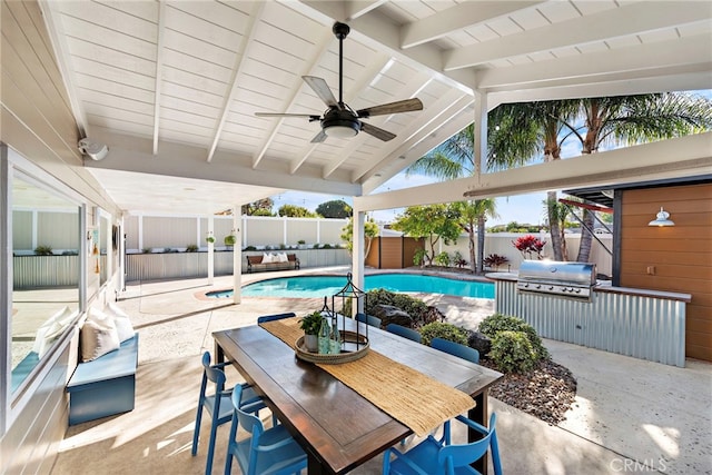 view of pool with grilling area, a patio, and ceiling fan