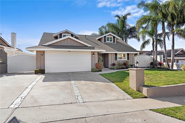 view of front of house with a garage and a front lawn