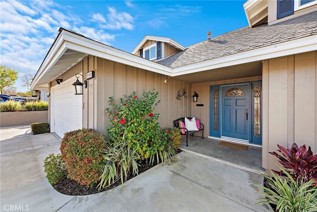 doorway to property featuring a garage