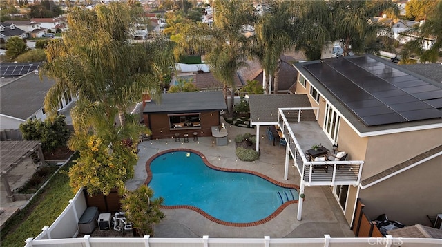 view of swimming pool with a patio and an outdoor bar