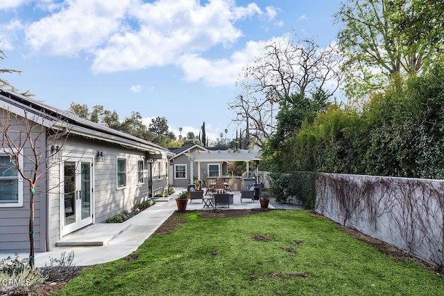 view of yard with a patio area and a pergola