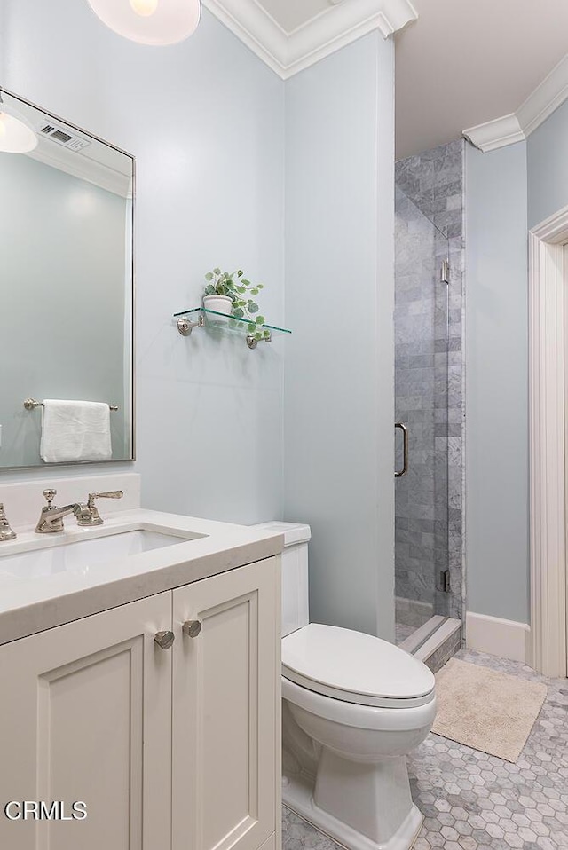 bathroom with a shower with door, tile patterned floors, ornamental molding, toilet, and vanity