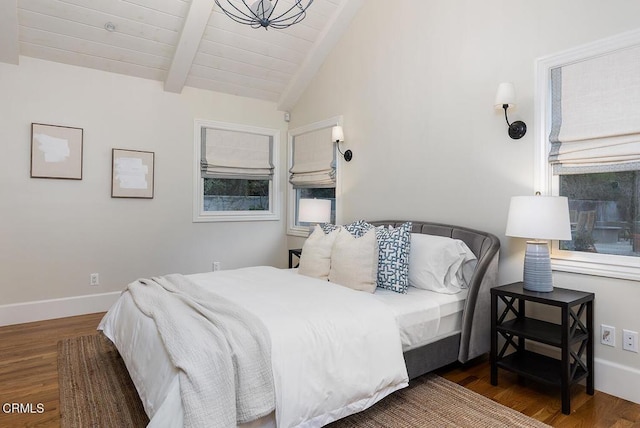 bedroom with wooden ceiling, vaulted ceiling with beams, and hardwood / wood-style floors