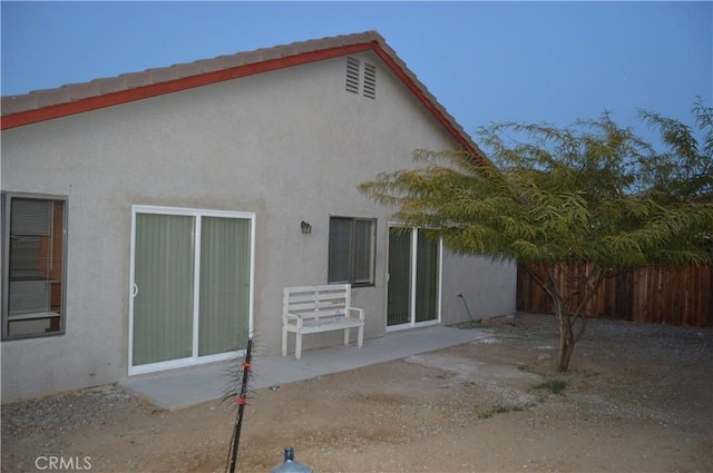 rear view of house with a patio