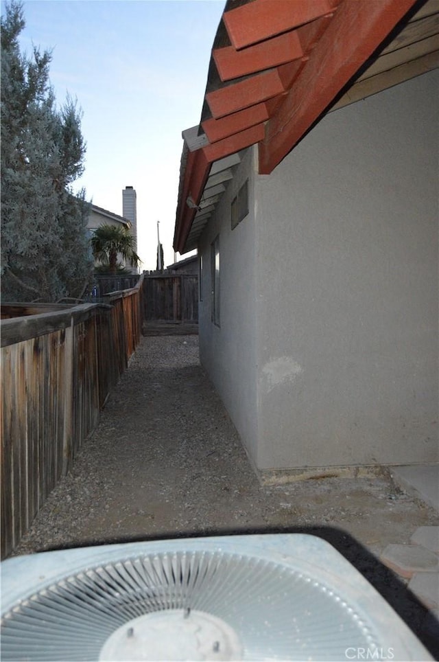 view of side of property with a patio