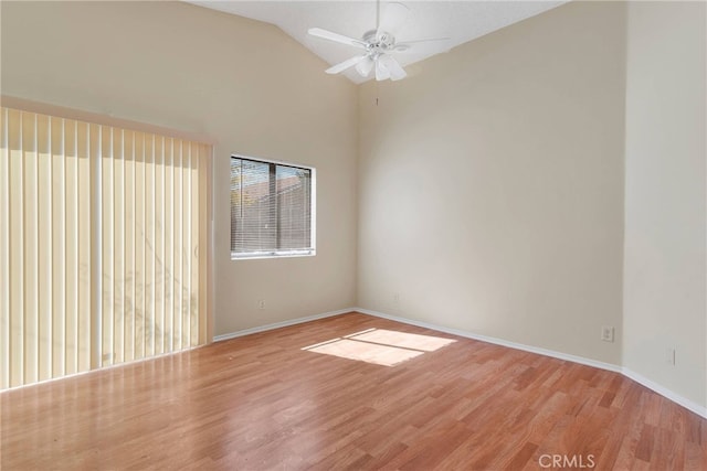 unfurnished room featuring vaulted ceiling, ceiling fan, light wood finished floors, and baseboards