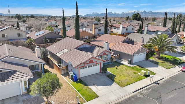 bird's eye view featuring a residential view and a mountain view